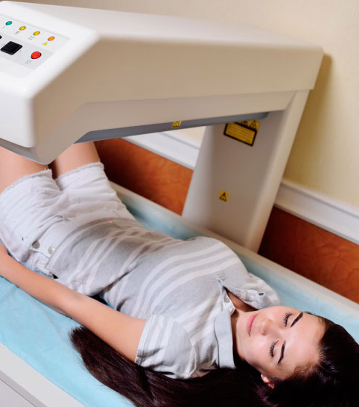 smiling radiologist standing near patient while making mammograp smiling radiologist standing near patient while making mammograp